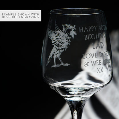 Personalised Liverpool wine glass with engraved text and liverbird design on a black background