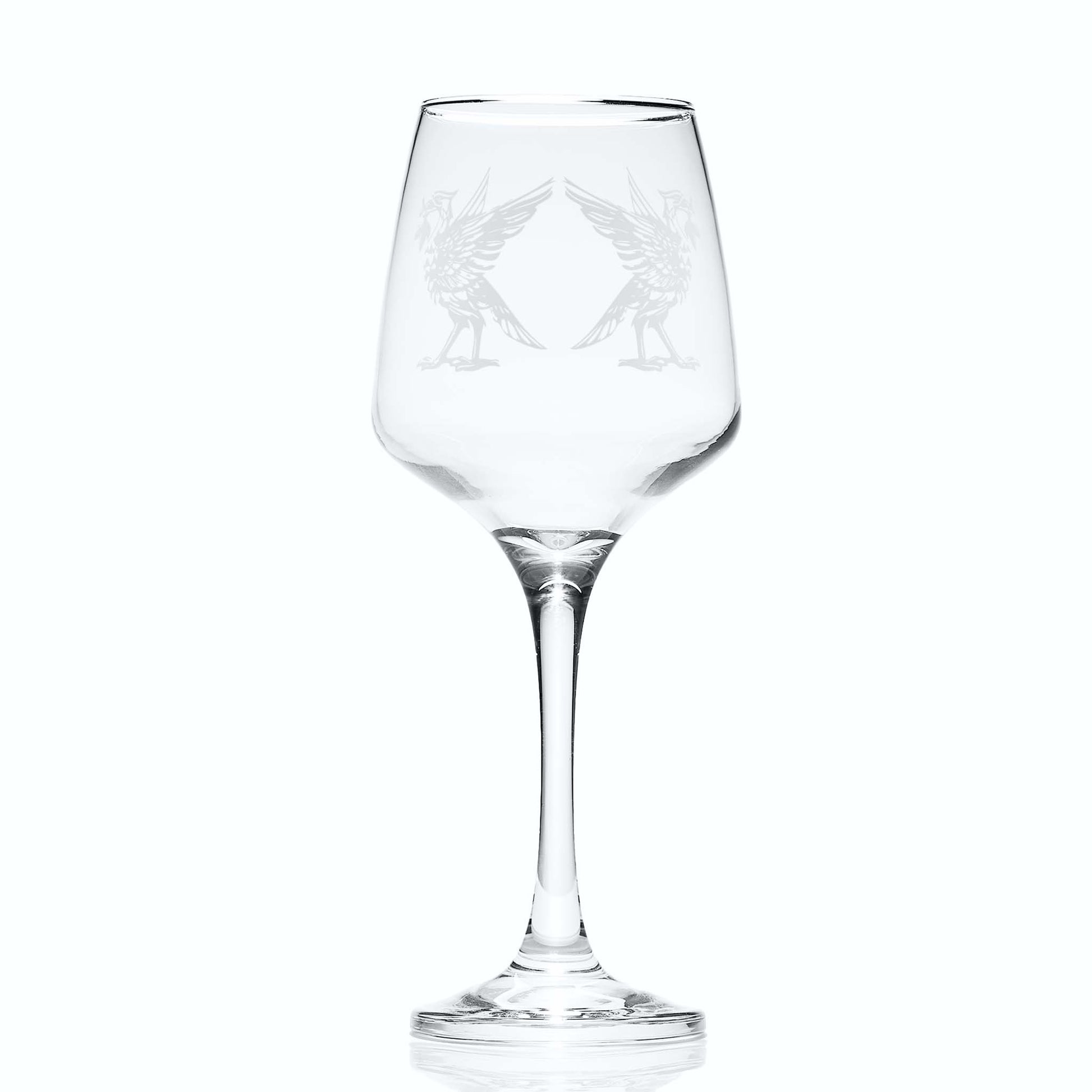Clear wine glass with engraved liverbird design on a white background