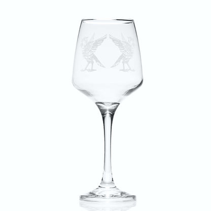 Clear wine glass with engraved liverbird design on a white background