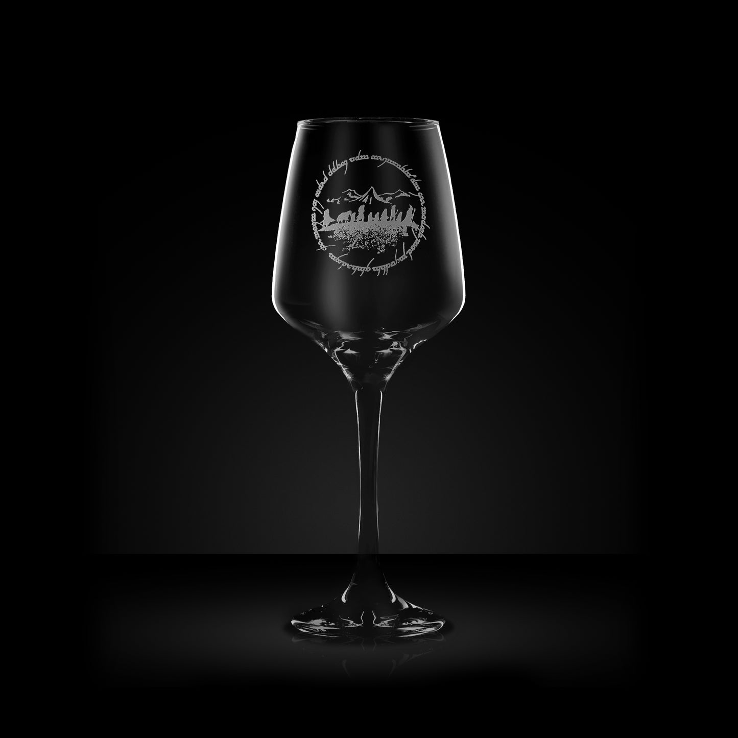 engraved wine glass with mountain, wizards and elvish text