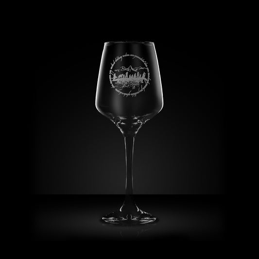 engraved wine glass with mountain, wizards and elvish text