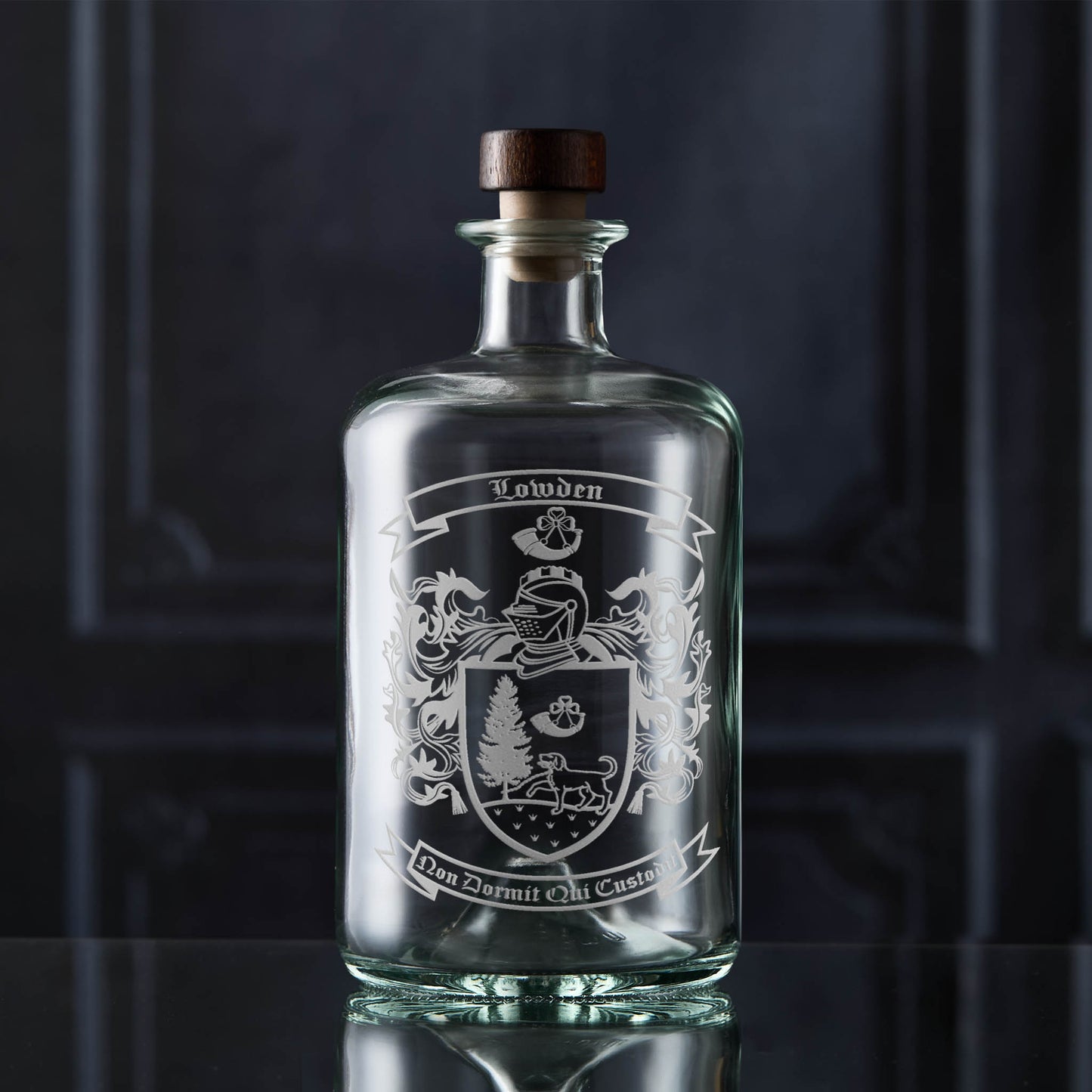Glass apothecary decanter featuring the a heraldic family crest — crisp, permanent sandblasted detail.