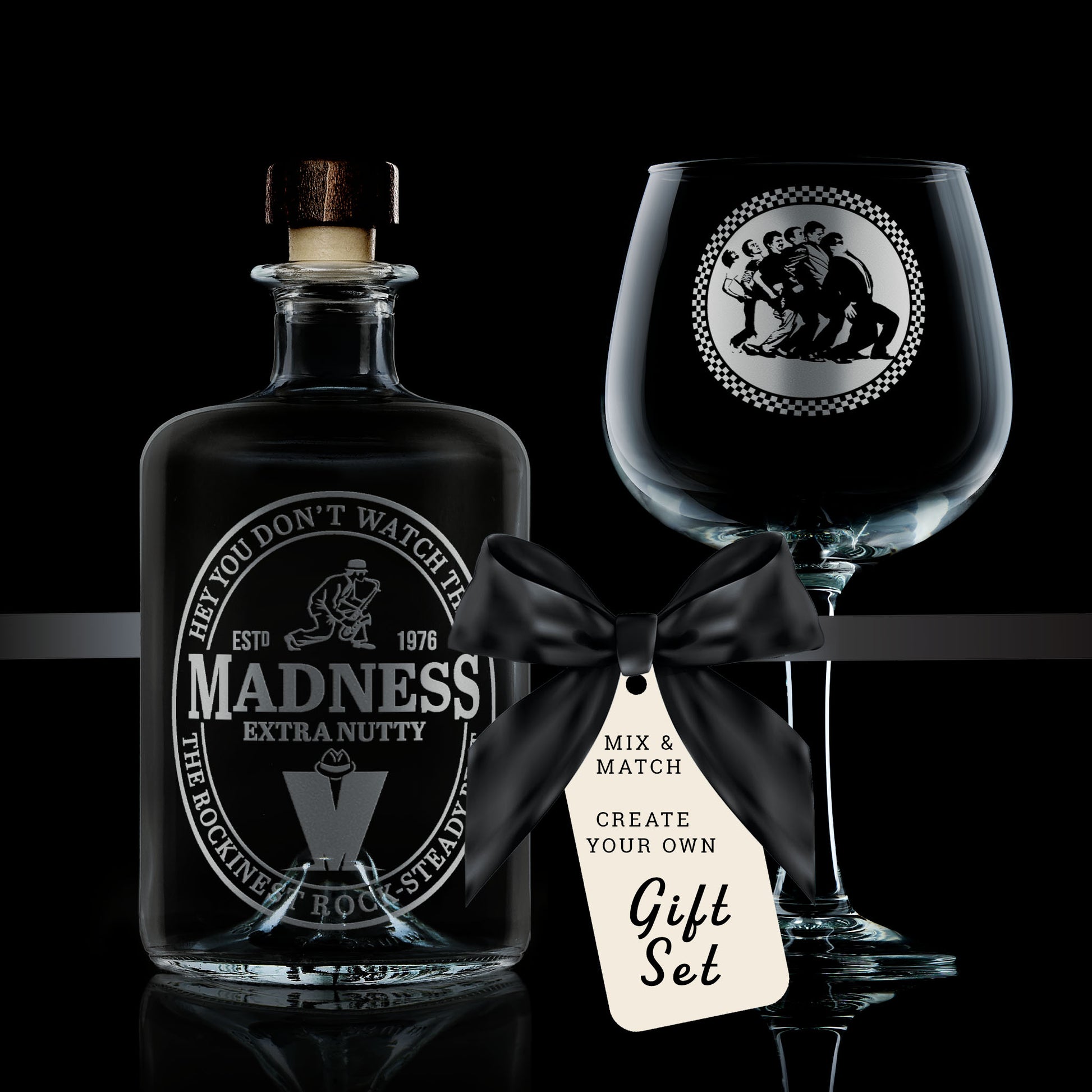 gift set comprising of a stemmed gin glass and glass decanter engraved with madness nutty boys