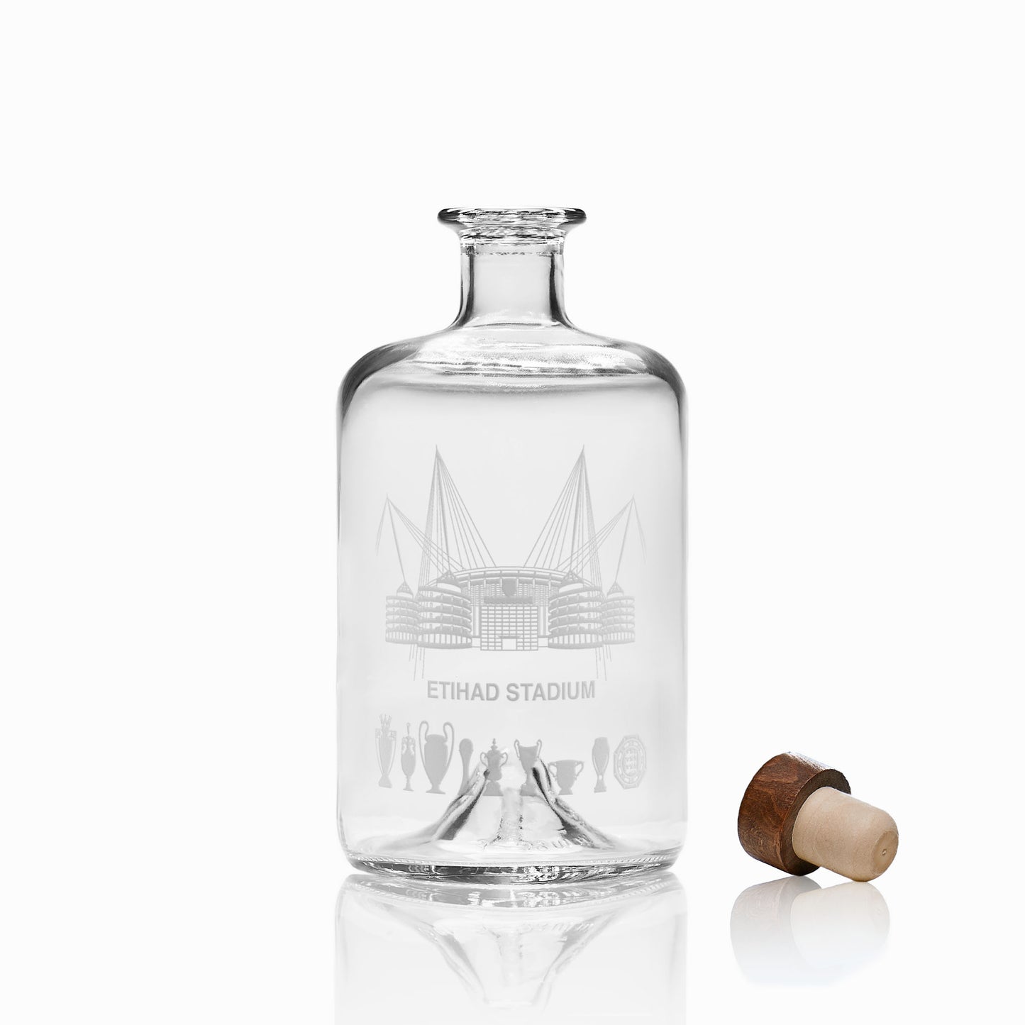 Engraved glass decanter featuring Etihad Stadium line-art and symbolic trophy silhouettes.