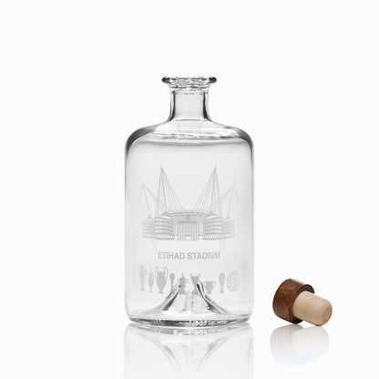 Engraved glass decanter featuring Etihad Stadium line-art and symbolic trophy silhouettes.