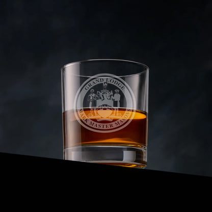 Engraved Mark Master Mason whisky glass with Masonic emblem on black background