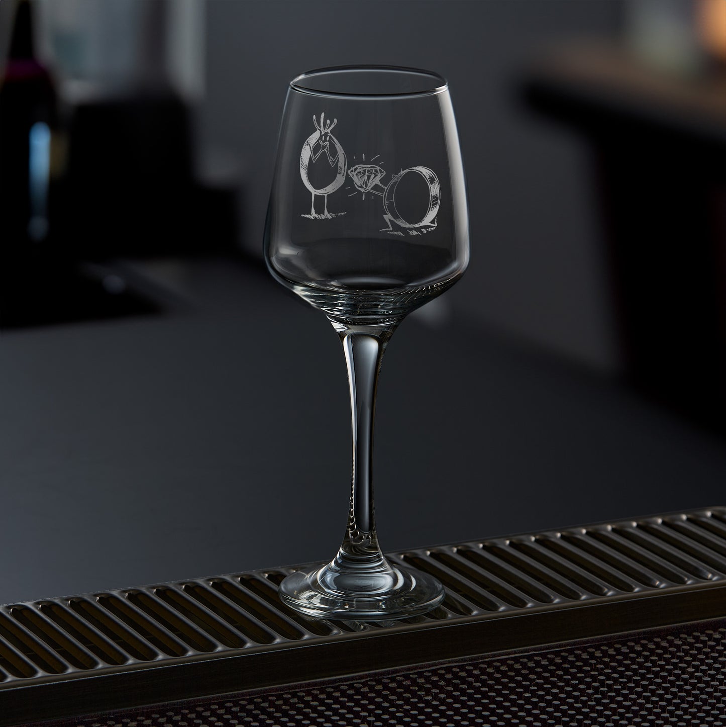 Engraved wine glass with marriage proposal design between two rings — one kneeling, one crowned