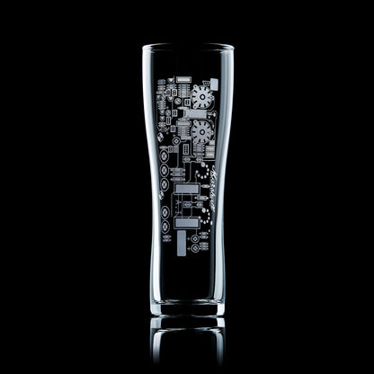 Engraved beer glass with guitar amp circuit board design, shown on a black background.