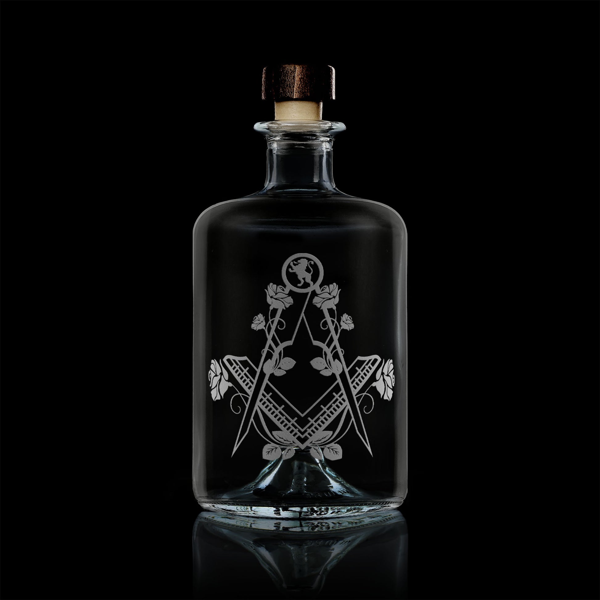 apothecary bottle style whisky decanter engraved with english roses and masonic square and compass