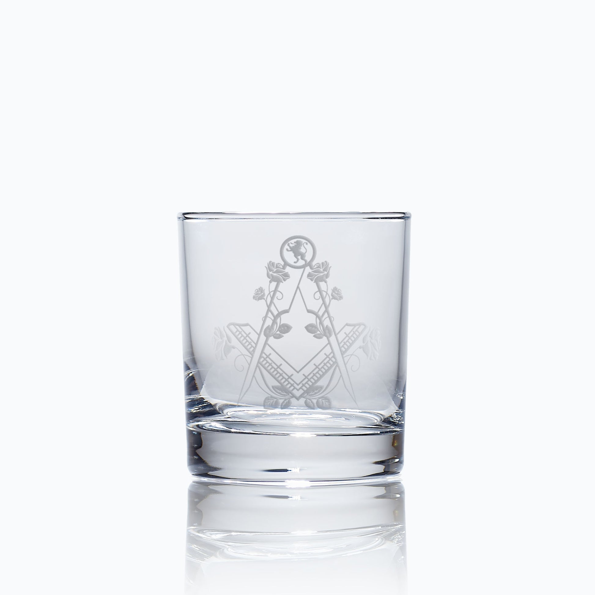 masonic whisky glass engraved with the lion rampant, roses and a square and compass