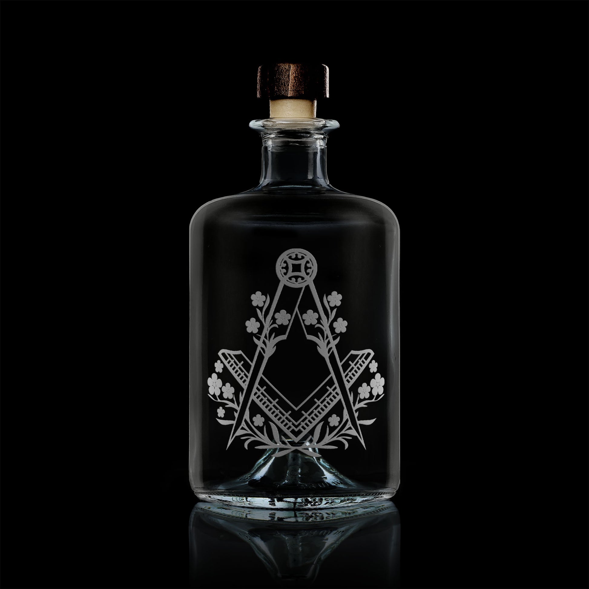 apothecary bottle style whisky decanter engraved with forget me nots and masonic square and compass