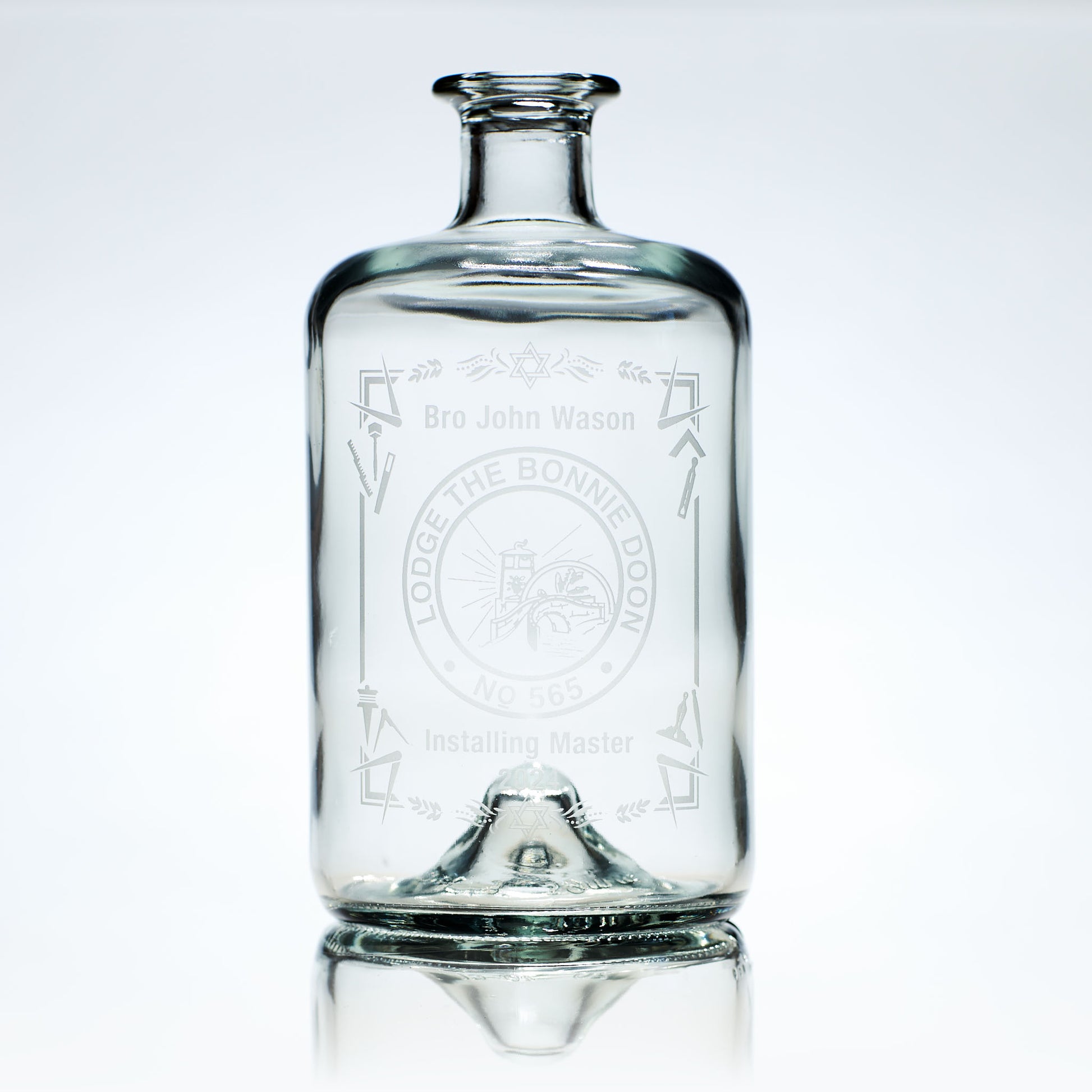 engraved whisky decanter etched with masonic symbols and lodge crest