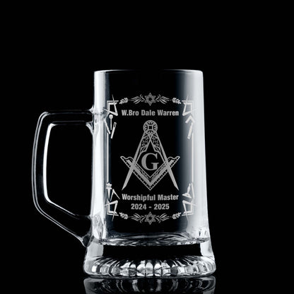 Masonic tankard with filigree Square & Compass and working tools, engraved and shown on black background