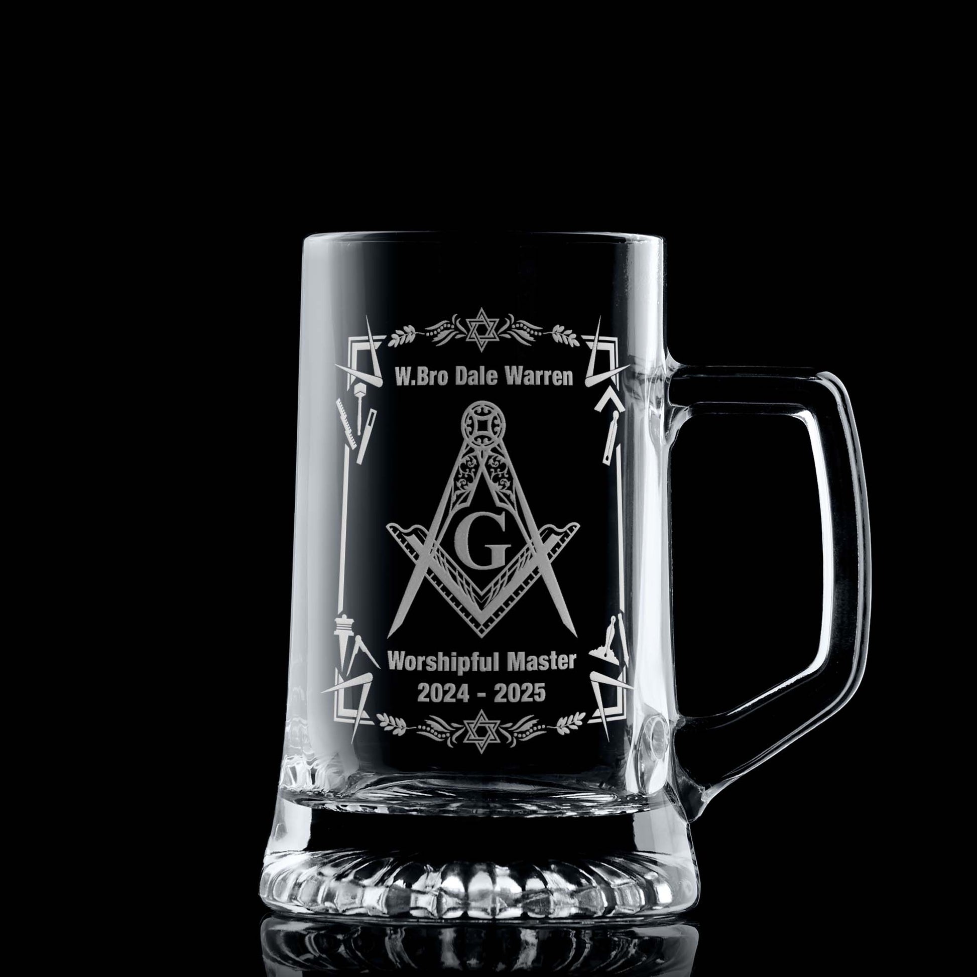 Masonic tankard with filigree Square & Compass (with a G) and working tools, engraved and shown on black background