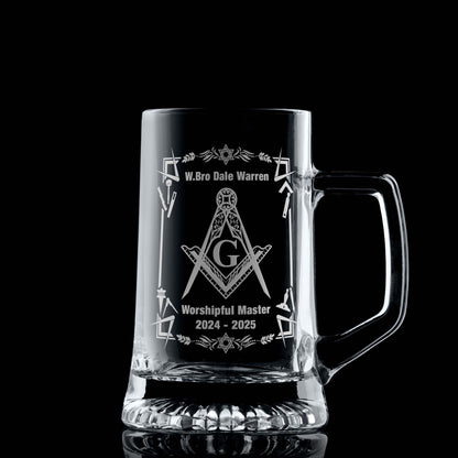 Masonic tankard with filigree Square & Compass (with a G) and working tools, engraved and shown on black background