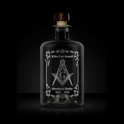 engraved apothecary bottle etched with working tools, freemasonry symbols and square and compass