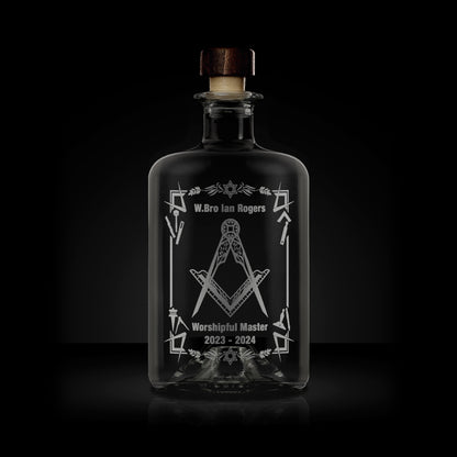 engraved apothecary bottle etched with working tools, freemasonry symbols and square and compass