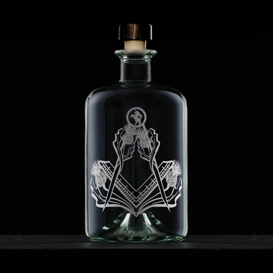 apothecary bottle style whisky decanter engraved with scottish thistles and masonic square and compass