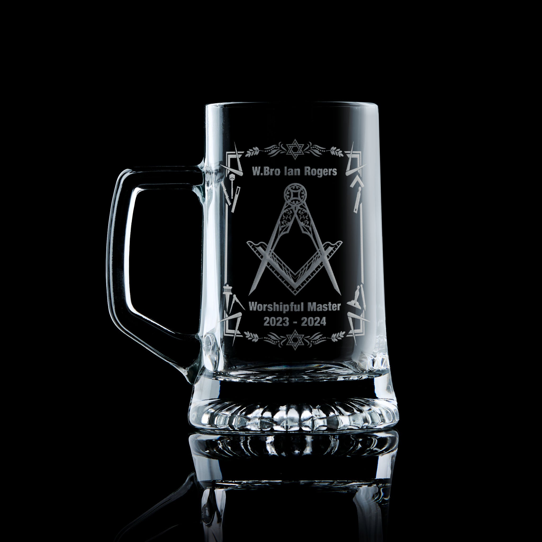 Masonic tankard with filigree Square & Compass and working tools, engraved and shown on black background
