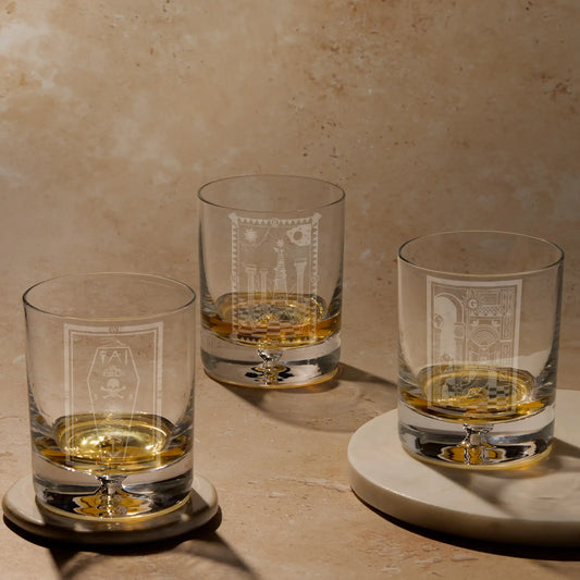 Three engraved whisky glass displaying Masonic tracing board designs.