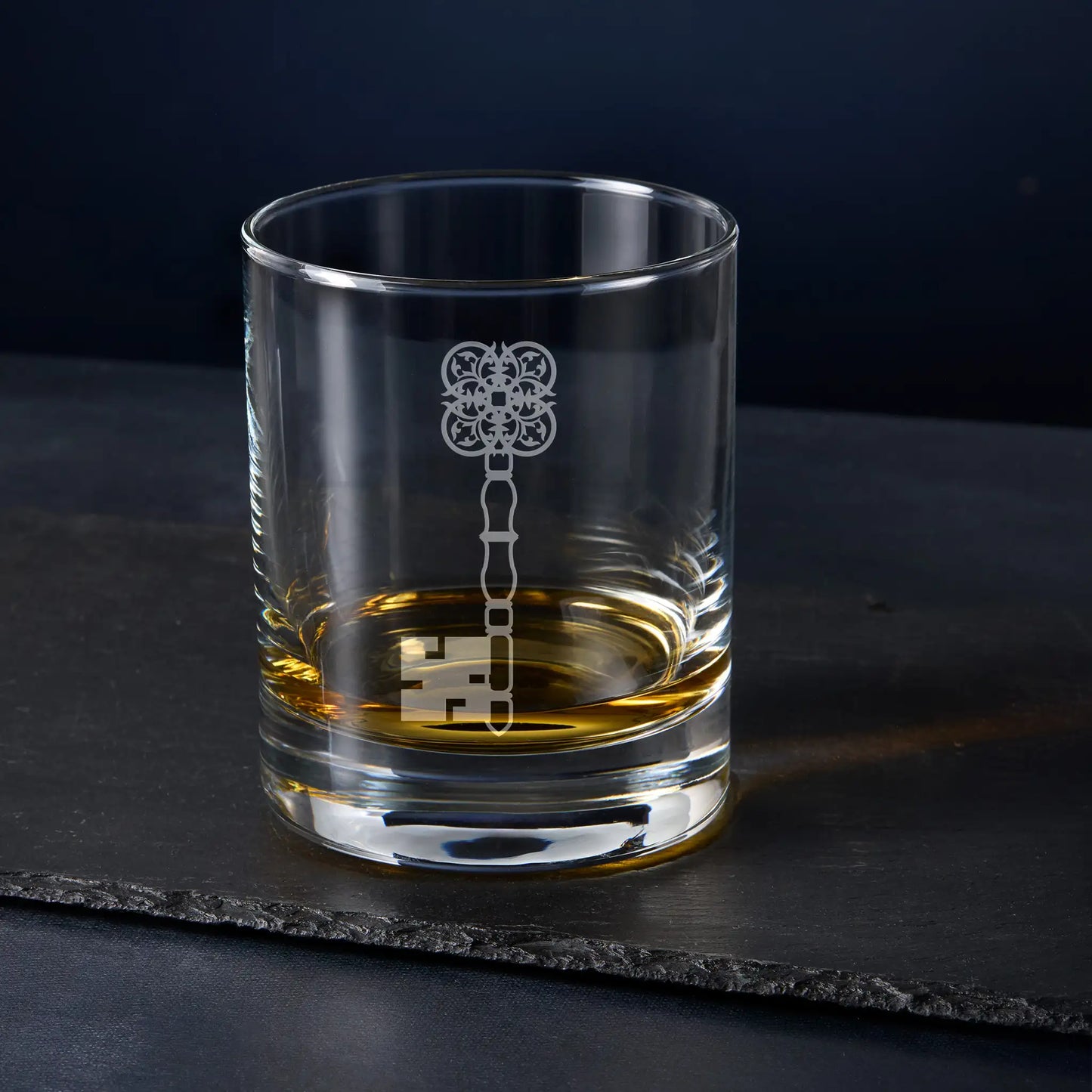 Masonic Treasurer whisky glass – English Constitution jewel engraving on black background
