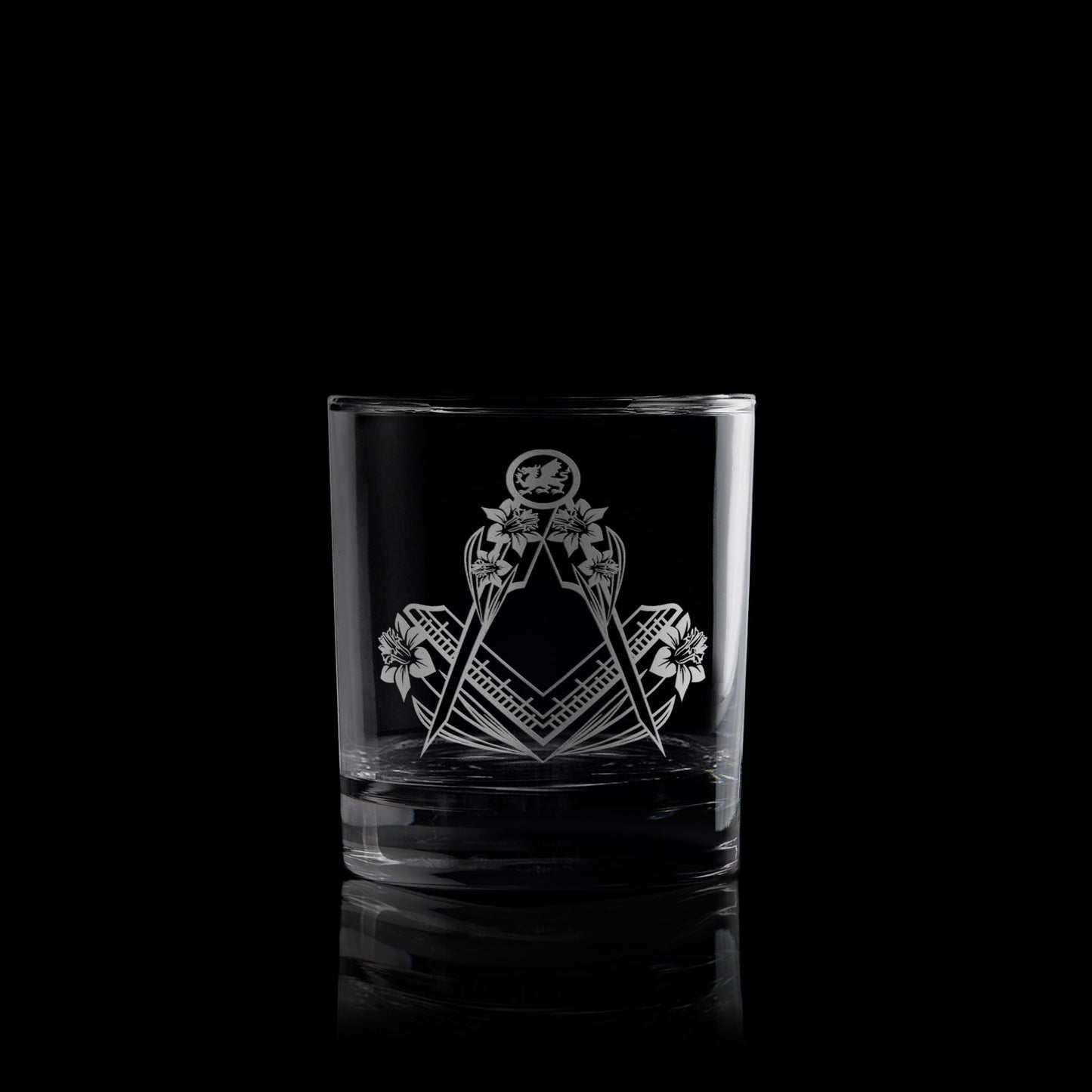 masonic whisky glass engraved with a welsh dragon, daffodils and a square and compass