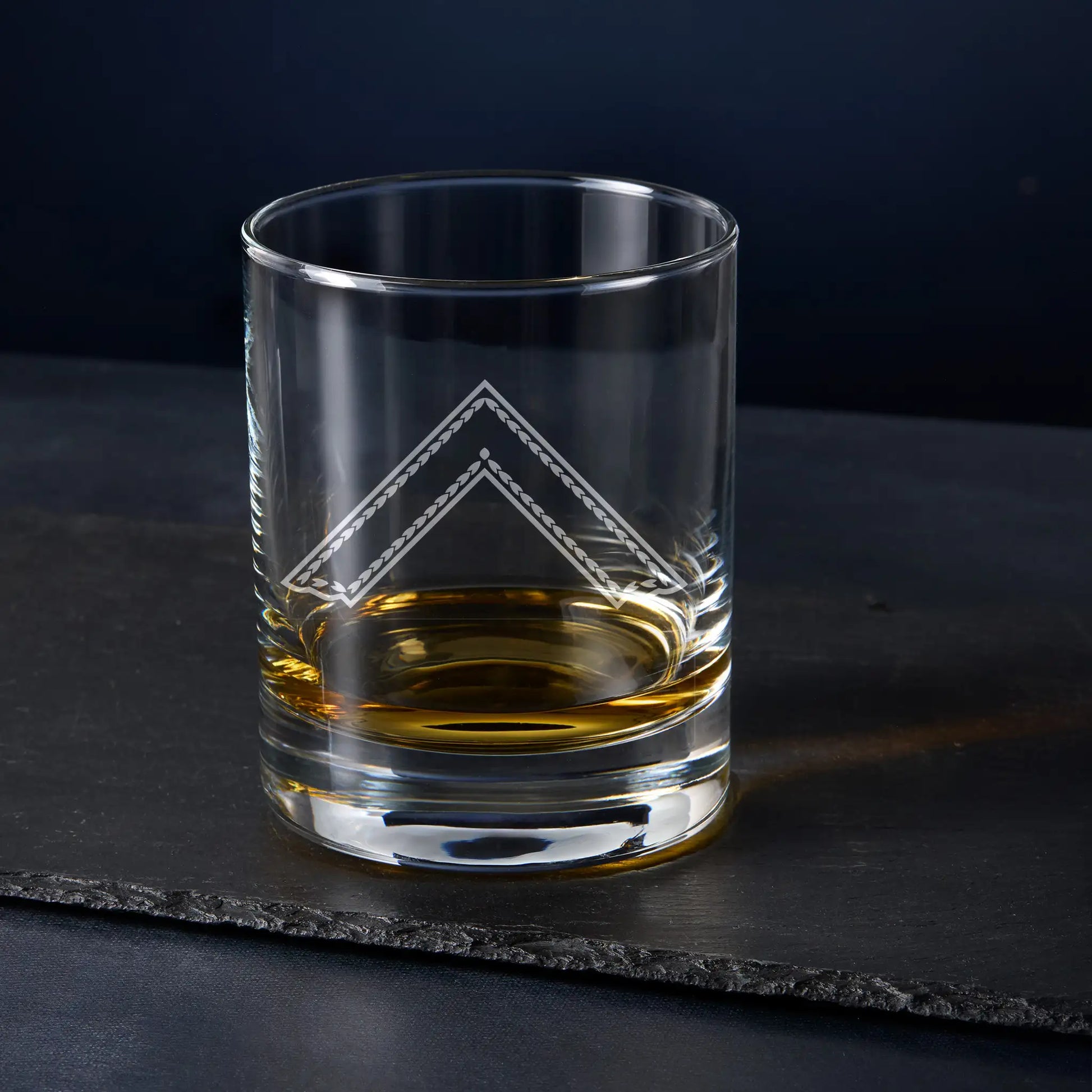 Engraved Worshipful Master whisky glass with collar jewel on black background