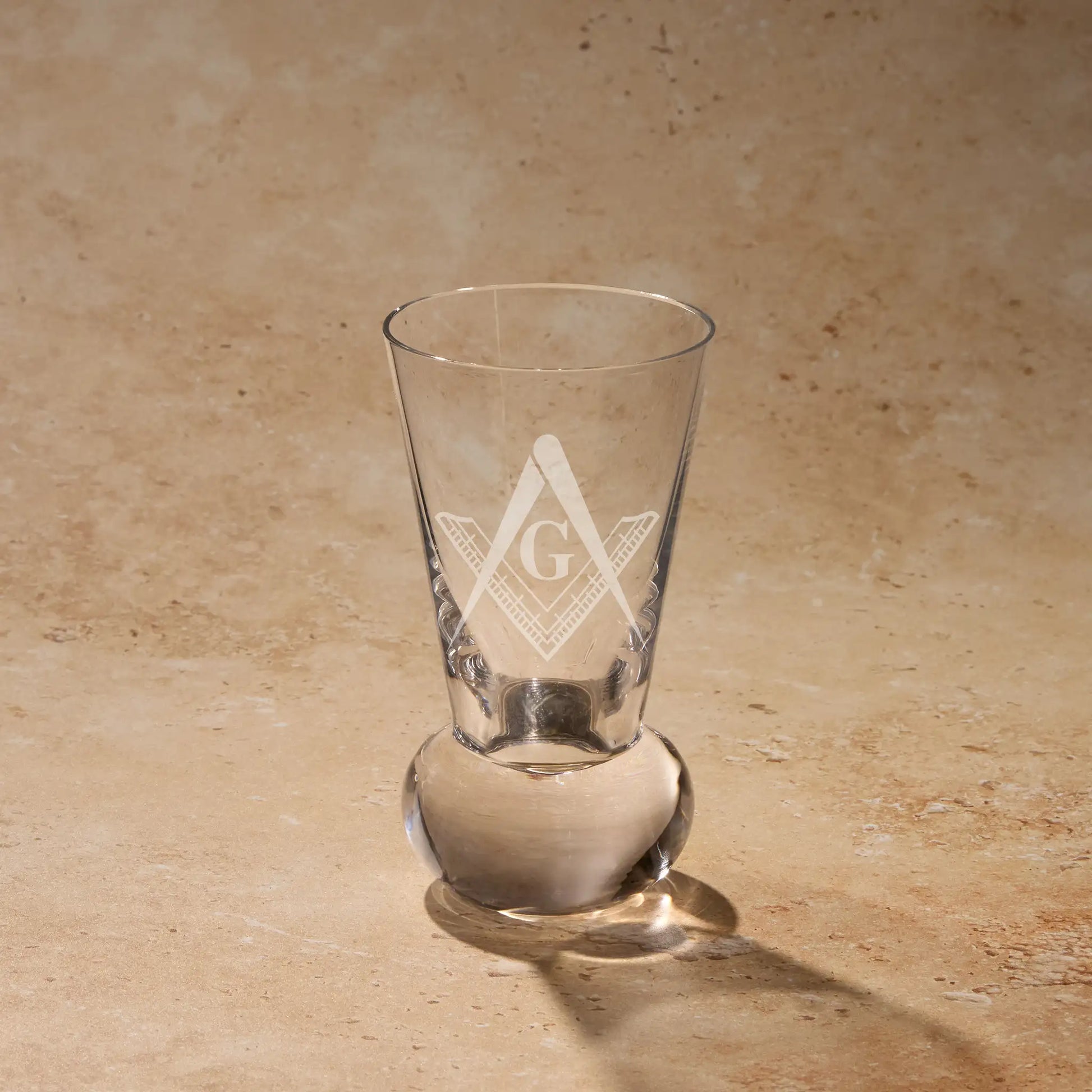 Master Mason Third Degree square and compass engraved on firing glass using traditional sandblasting.