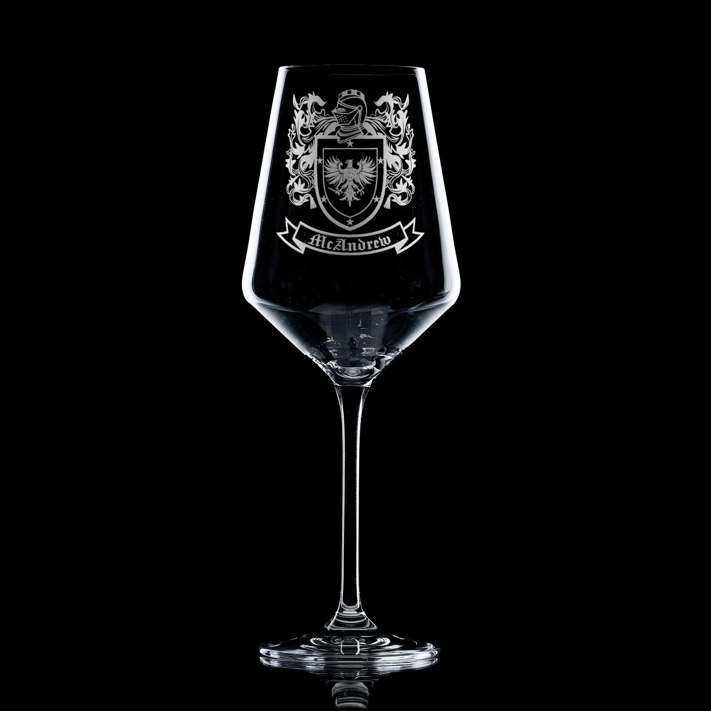 heraldic shield engraved on elegant wine glass — permanent, heirloom finish.