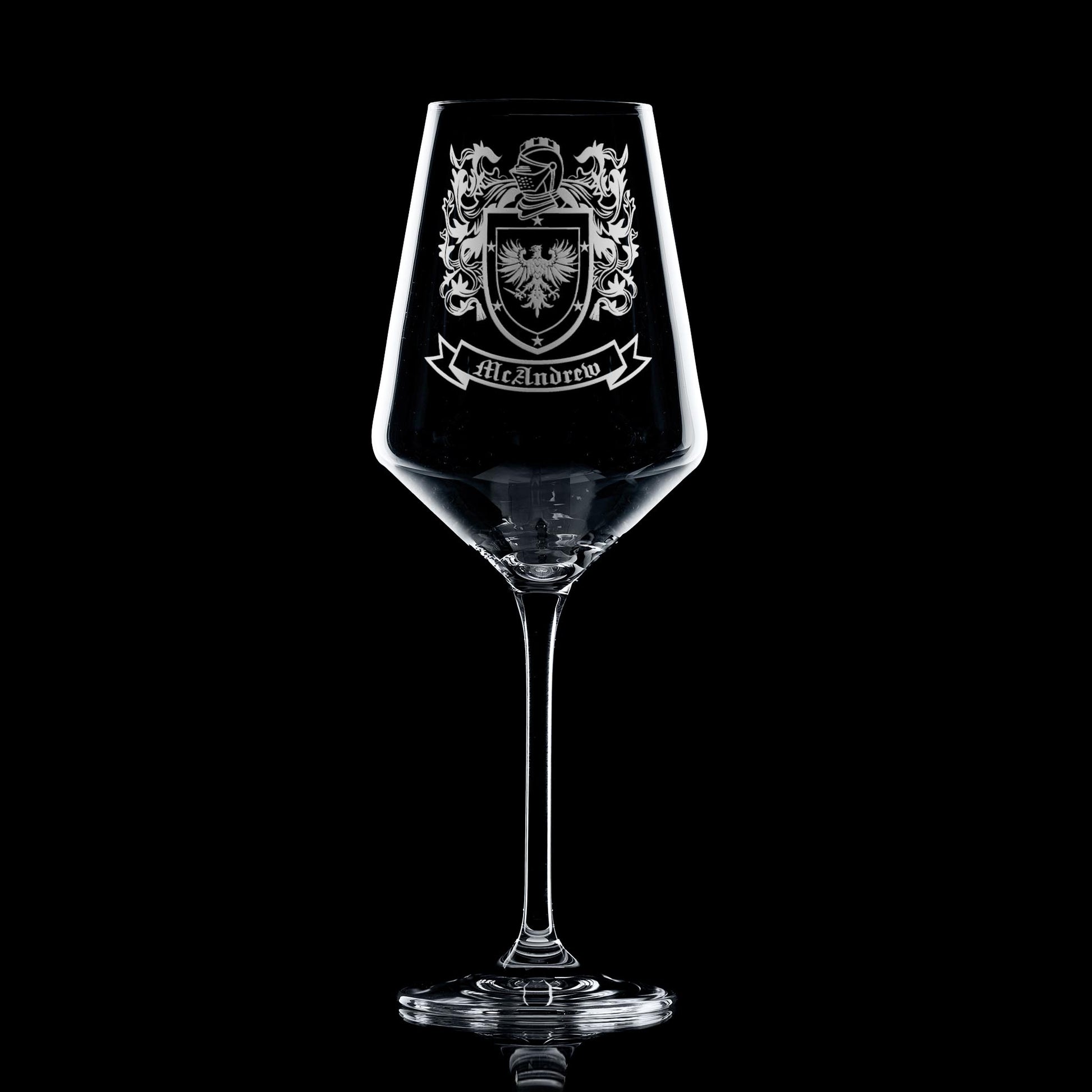 heraldic shield engraved on elegant wine glass — permanent, heirloom finish.