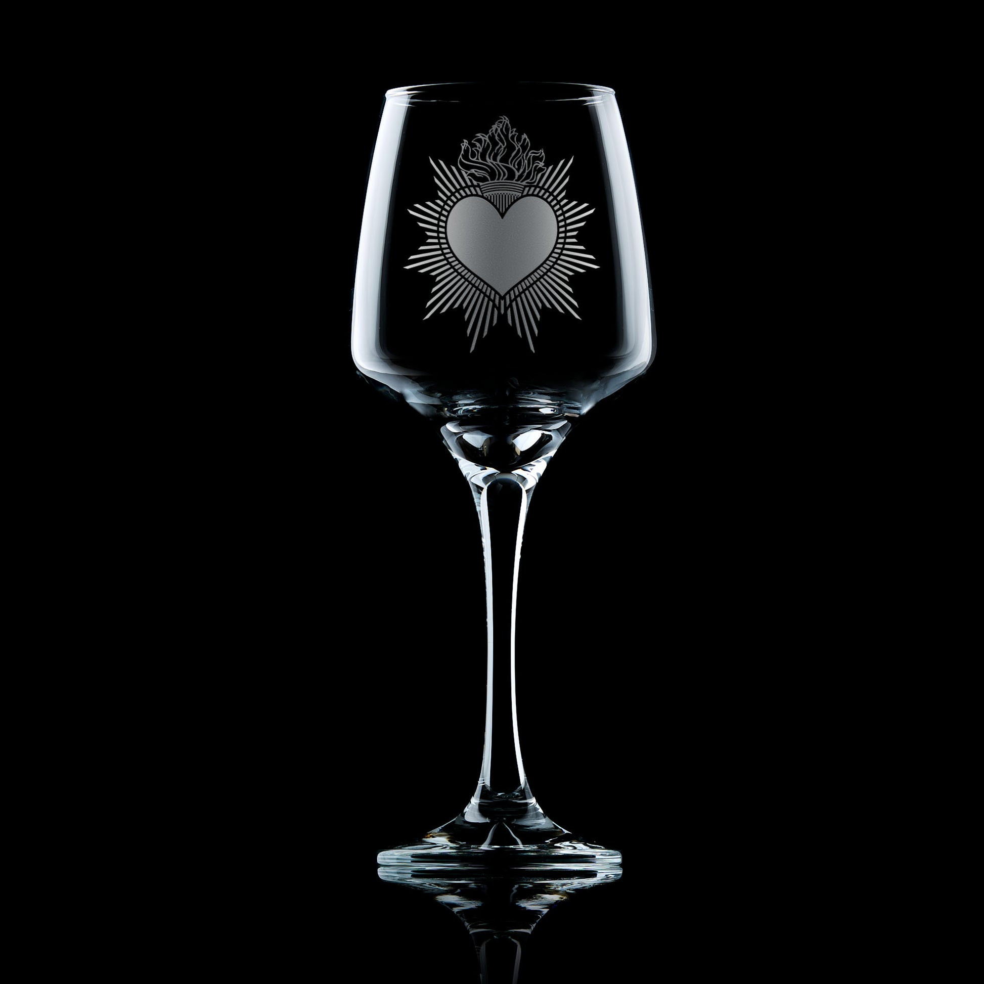 Engraved wine glass with Milagro Heart design in folk art style