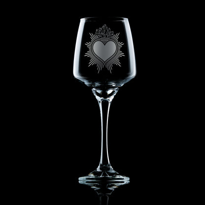 Engraved wine glass with Milagro Heart design in folk art style