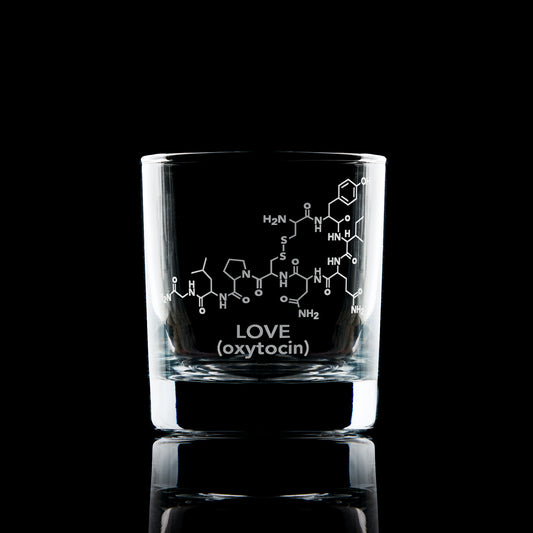 whiskey glass engraved with oxytocin molocules and the word love