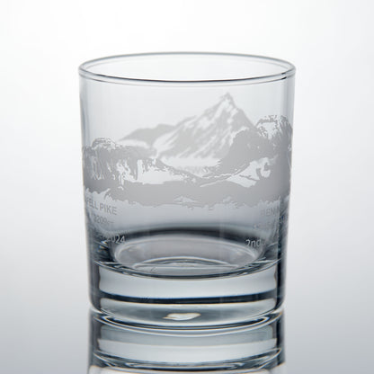 Whisky glass engraved with Scafell Pike, Ben Nevis and Snowdon, photographed on a white background