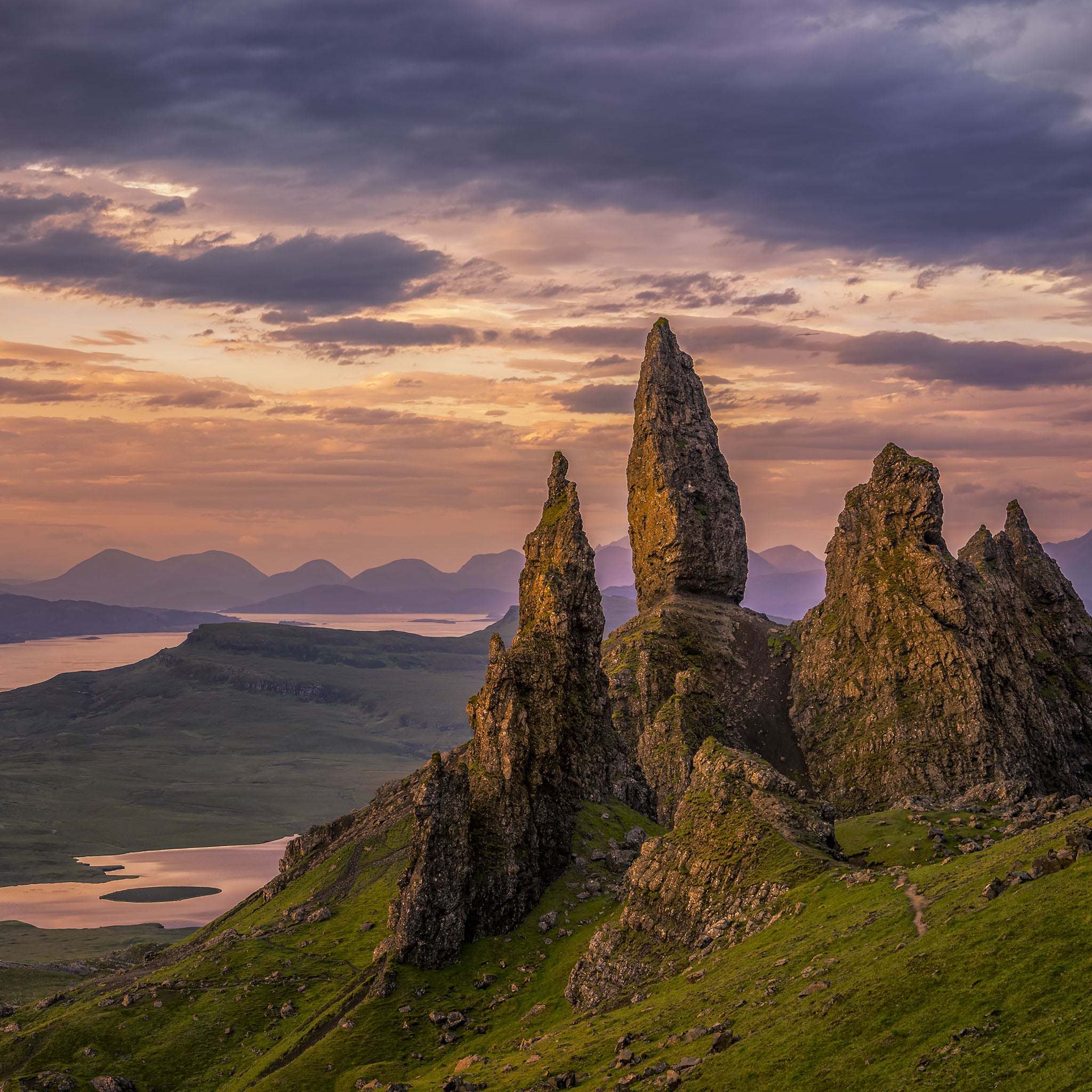 Rocks formations on a mountain with a sunset sky