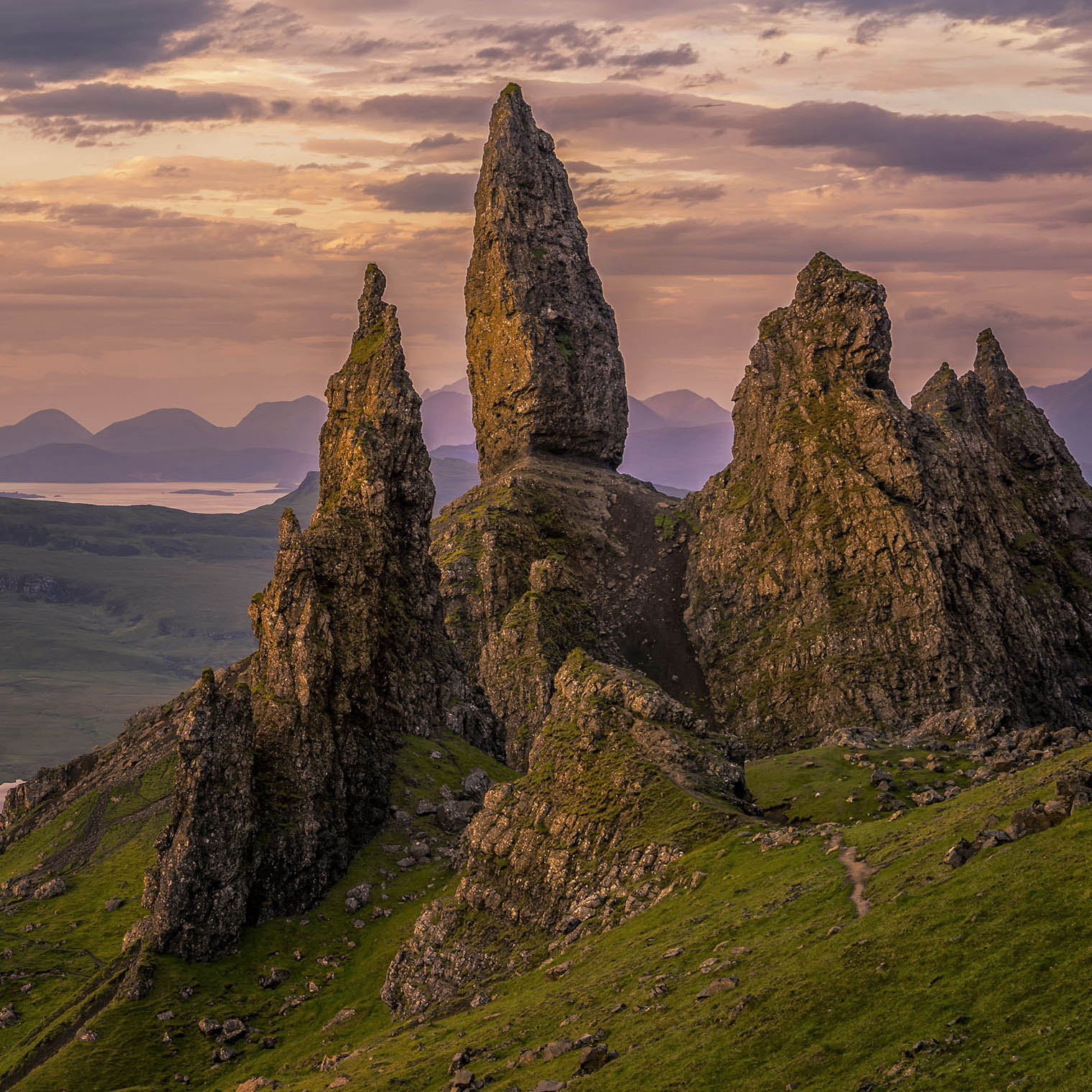 Rock formations on a mountain with a sunset sky