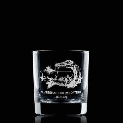 Loch Ness whisky glass with Nessie, a boat in the distance, and Latin text