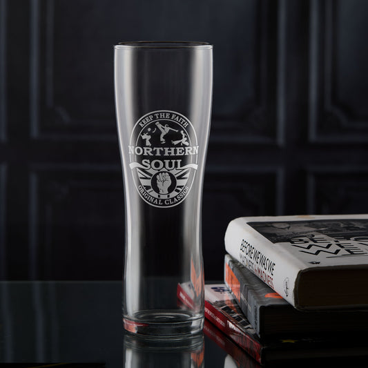 Northern Soul pint glass with a keep the faith clenched fist and original classics design on a dark background