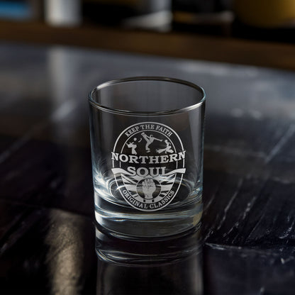Clear whisky glass with engraved Northern Soul design on a dark surface