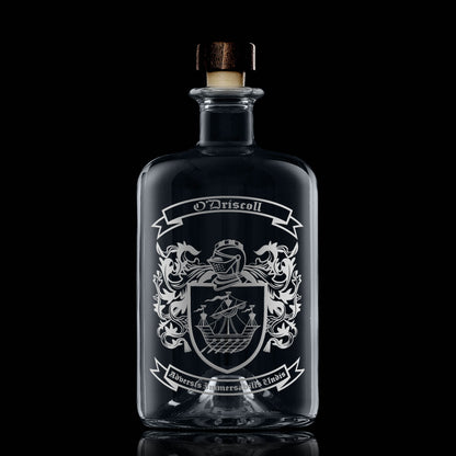 Heraldic coat of  arms engraved on apothecary decanter with stopper — balanced placement, satin finish.