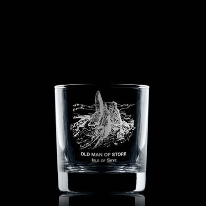 Engraved whisky glass featuring the Old Man of Storr and Isle of Skye text, shown on black background to highlight engraving detail