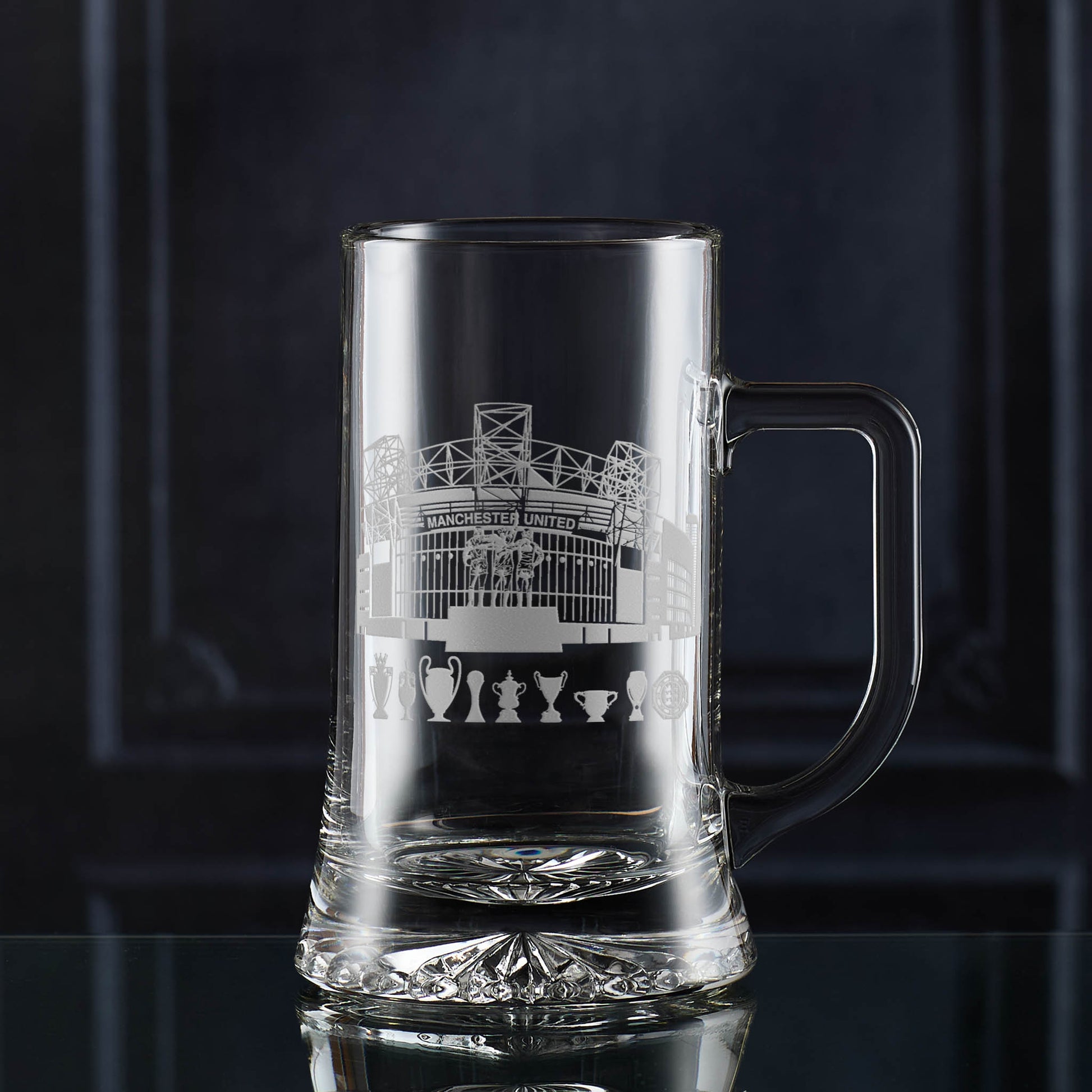 Beer tankard with Old Trafford engraved design on a dark background