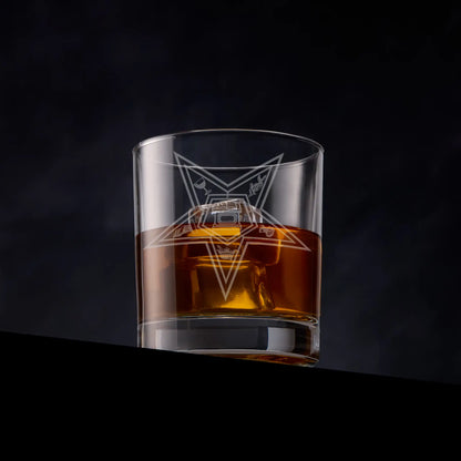 Masonic whisky tumbler with Order of The Easter Star engraved design on a dark background