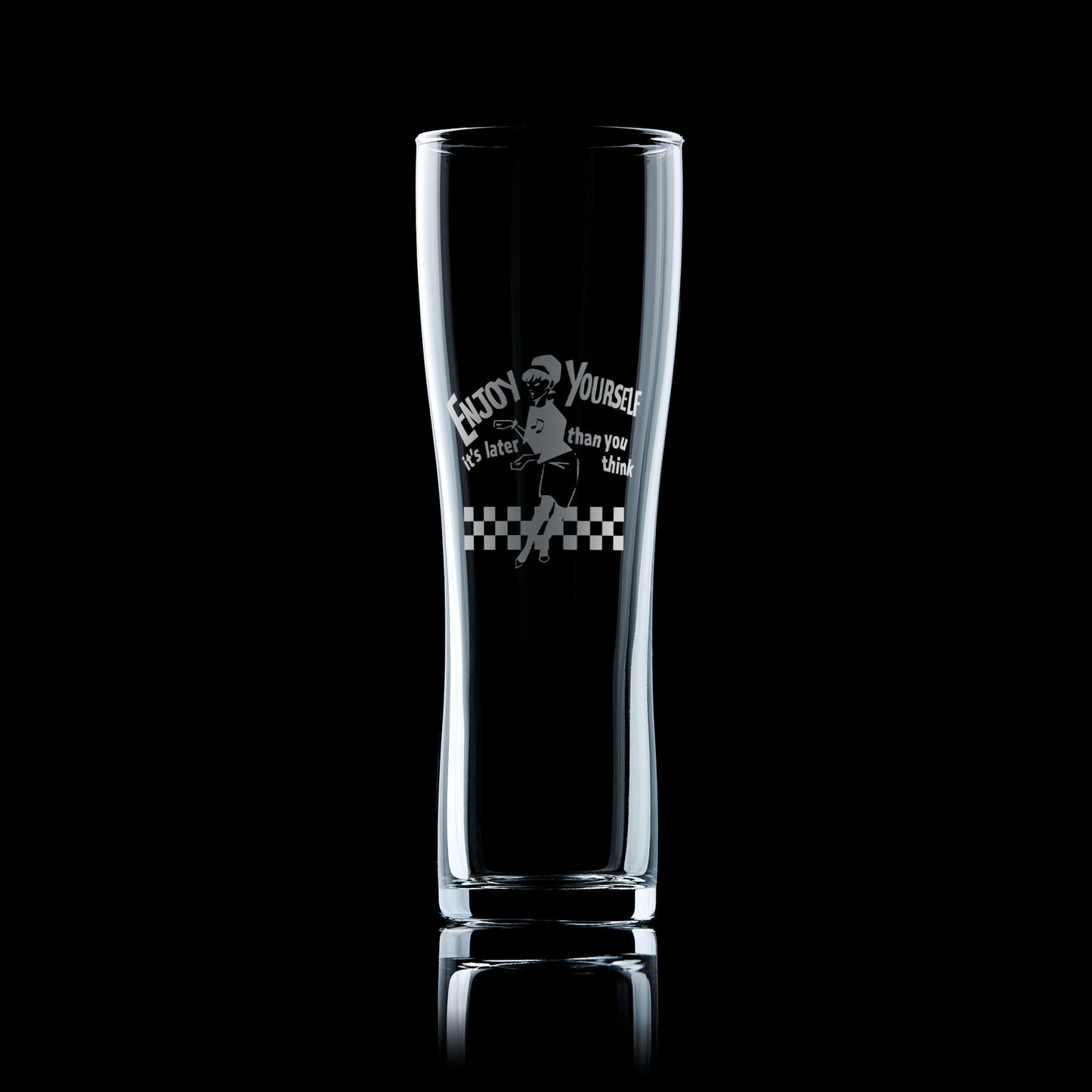 Engraved pint glass with the Original Beat Girl dancing on a checkerboard floor and the words “Enjoy Yourself,"