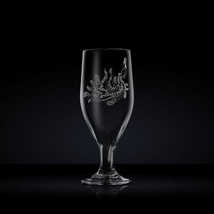 engraved stemmed beer glass etched with a peacock 