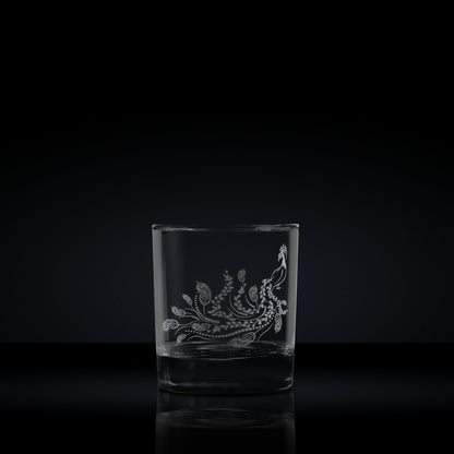 engraved whisky glass etched with a peacock 