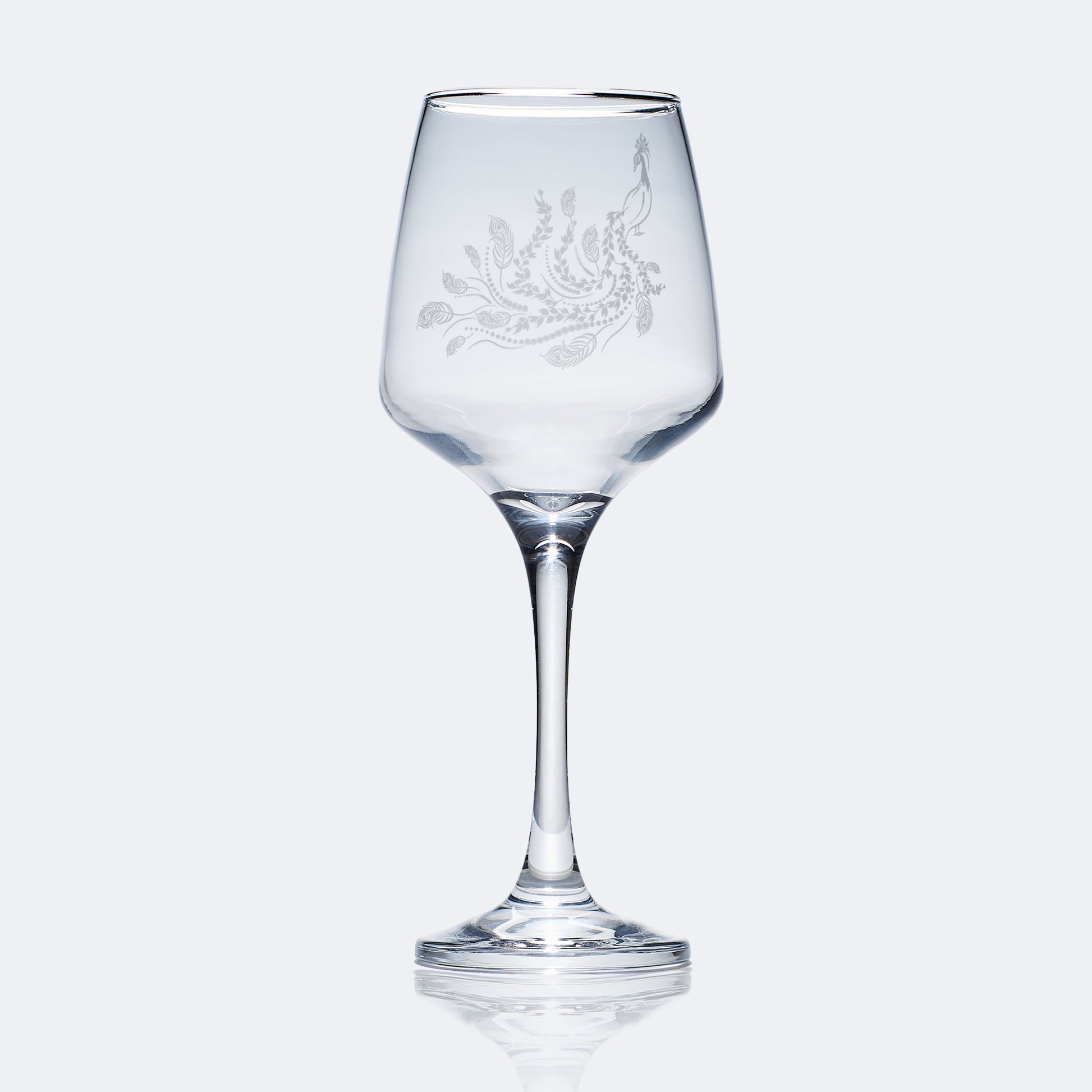 engraved wine glass etched with a peacock bird