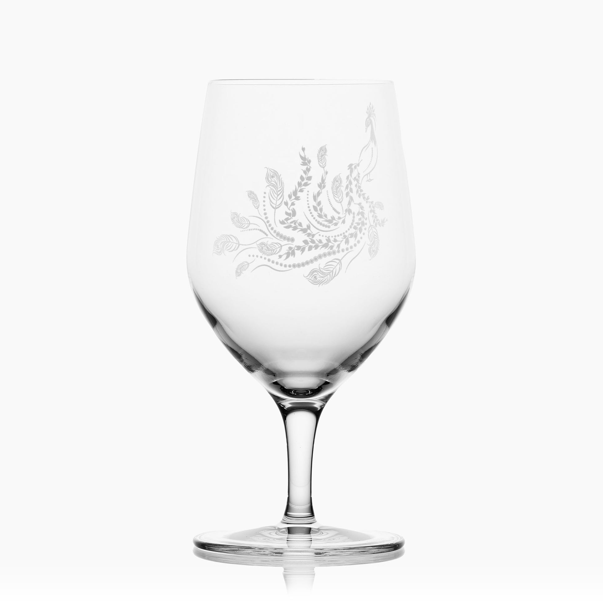 Front-view of engraved mineral water glass with peacock and leaf engraving, shown on a white background to highlight the shape of the glass