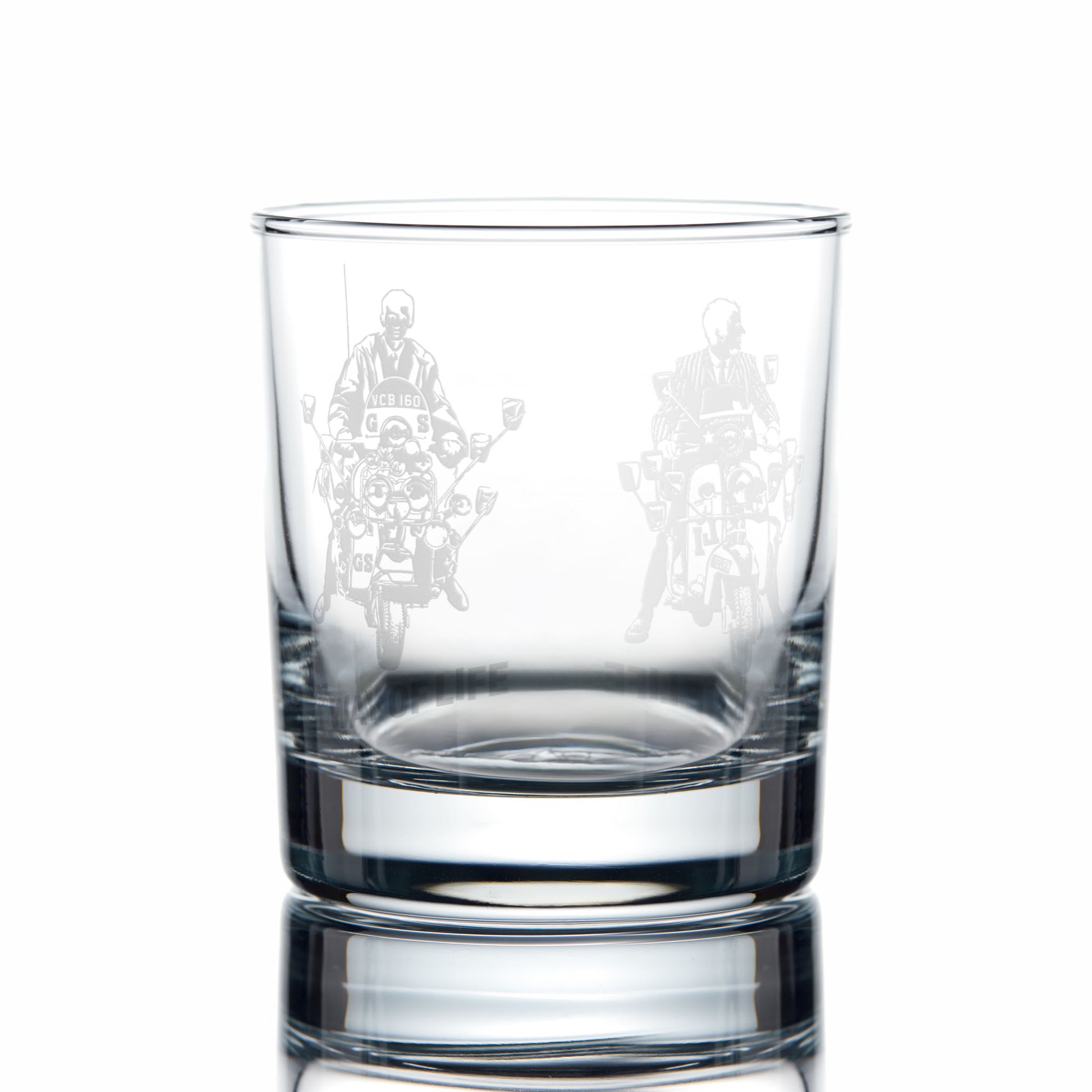 Clear glass whiskey tumbler with engraved scooter design on a white background