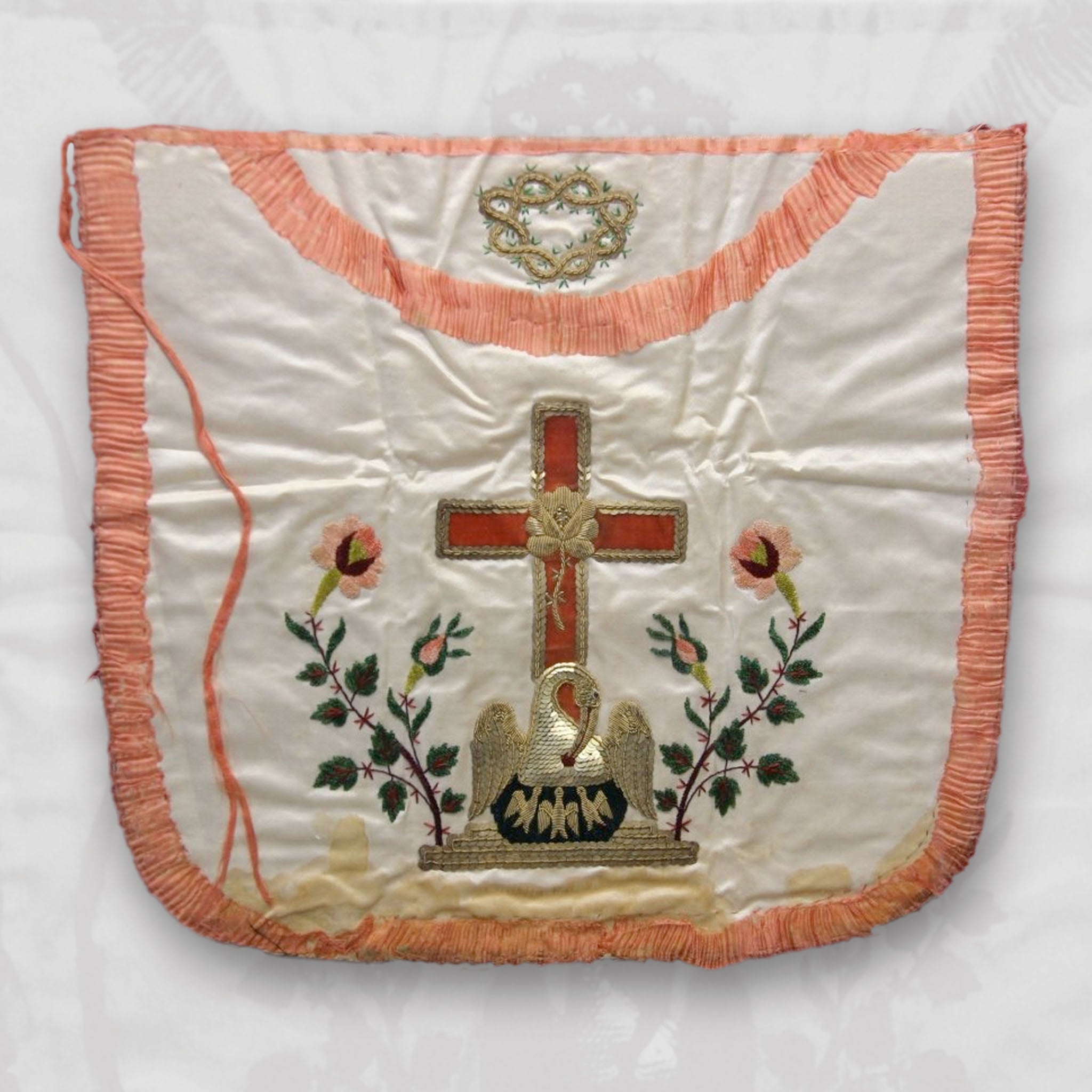 Embroidered Masonic lodge apron with rose croix cross and flowers on a white background